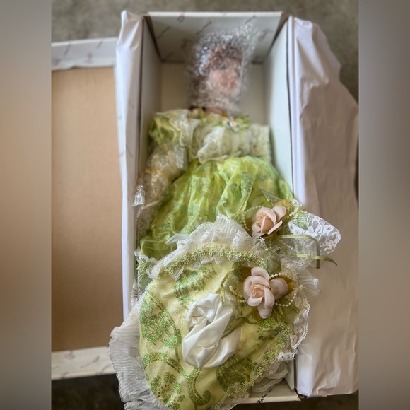 Elegant Green and White Doll with Floral Accents